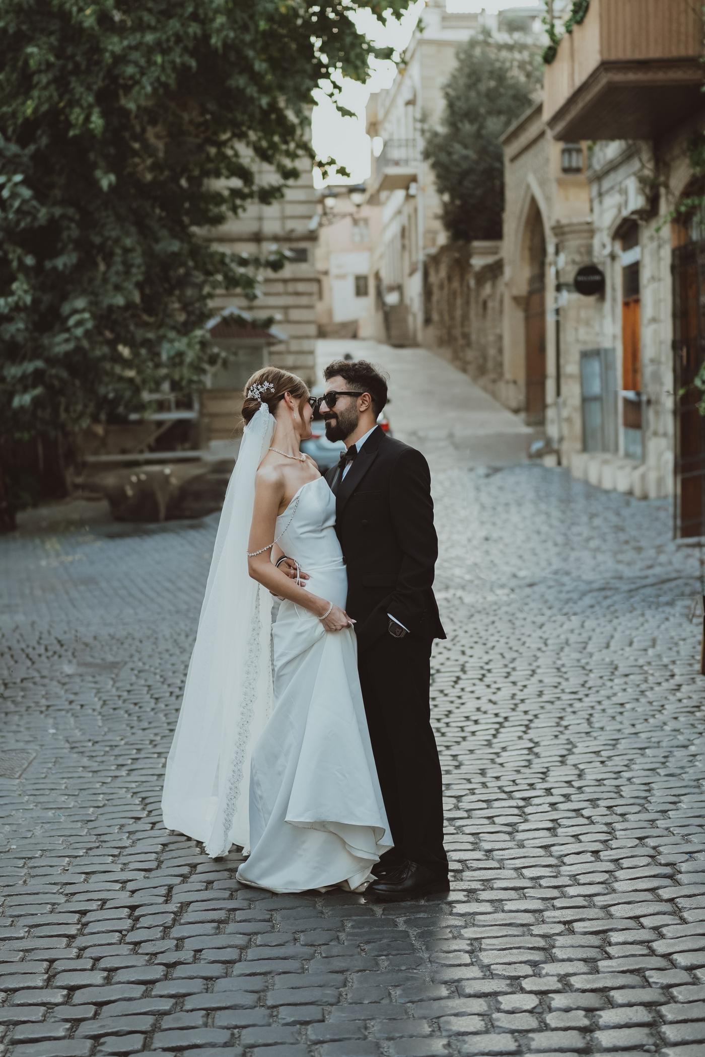 Bride and groom on a cobblestone street